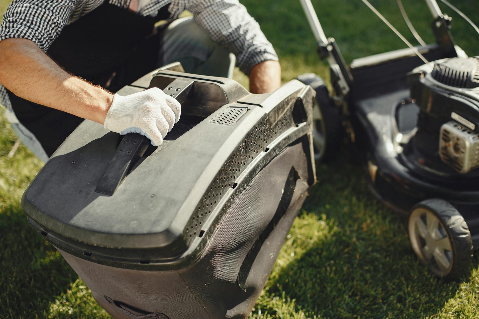 Landscape professional working on residential lawn care