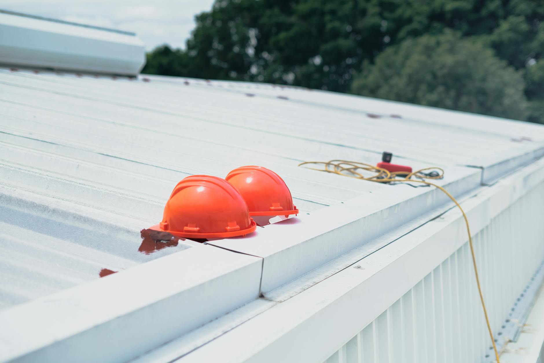Roof inspection scene with safety helmet